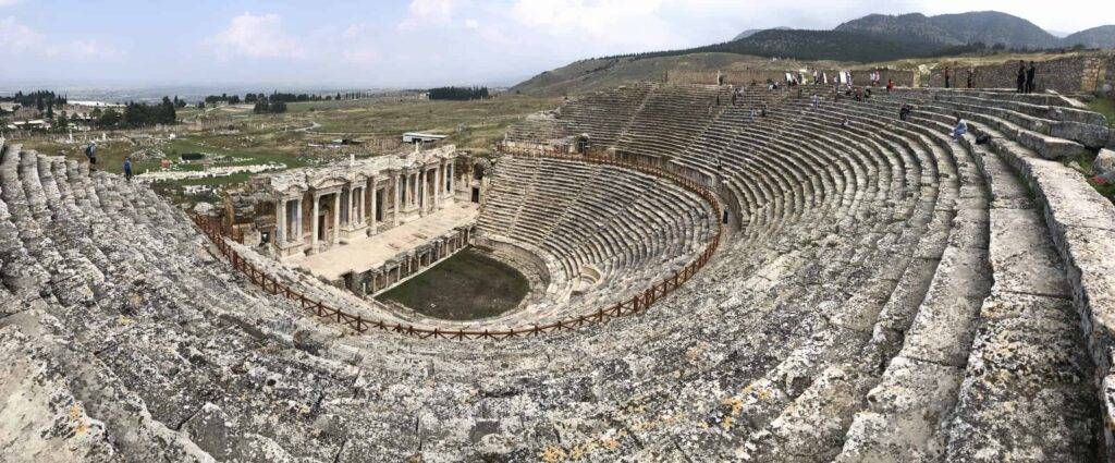 The amphitheater in Hierapolis, Pamukkale, is an ancient Roman structure located in present-day Turkey. It was built in the 2nd century AD and could accommodate around 15,000 spectators.