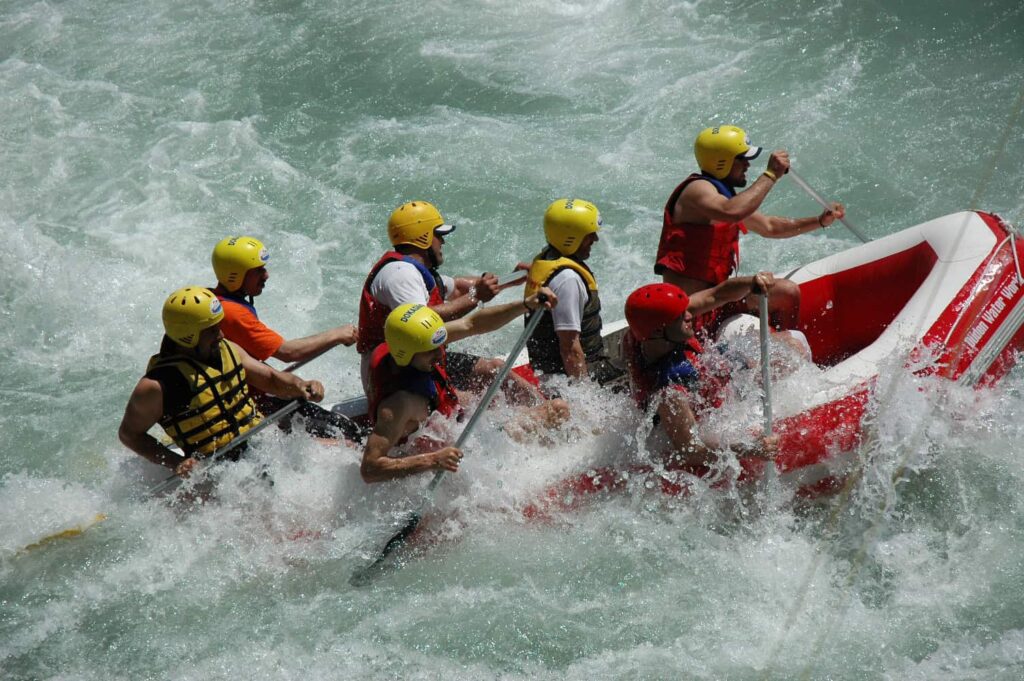 Turkey adventure holidays: raft speeding over white-water rapids in Antalya’s canyon landscapes.