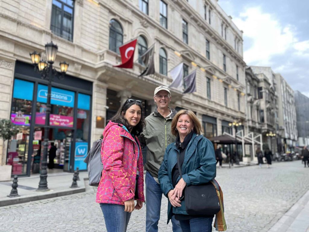 Ece Duluk with clients in front of Sanasaryan Hotel in Sirkeci