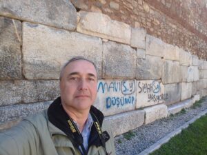 Enis Aköz standing beside the ancient Walls of Constantinople