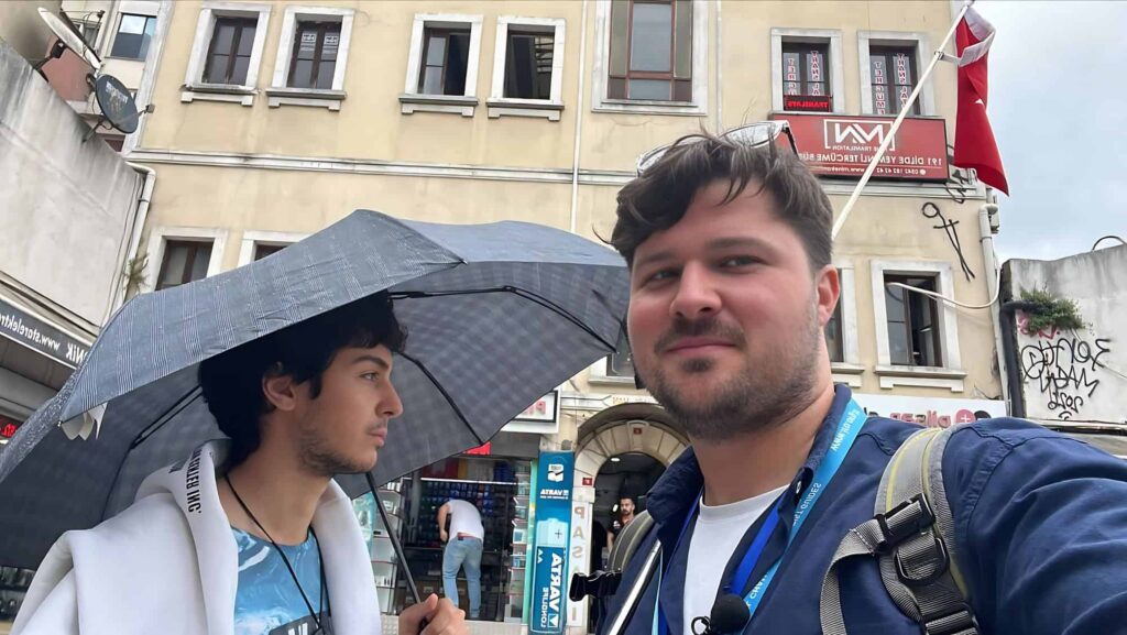 Deniz Karagozoglu and Tonga Bensan in front of The Other Tour office 2026