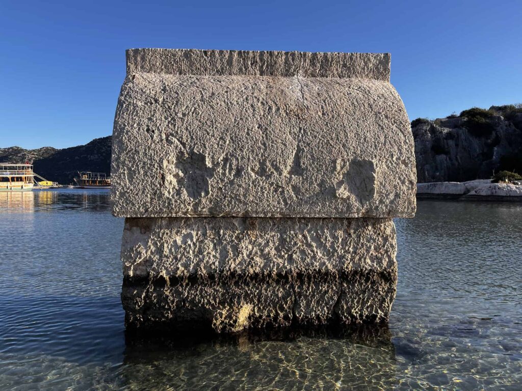 Lycian sarcophagi rising straight out of the shallow turquoise water - Demre