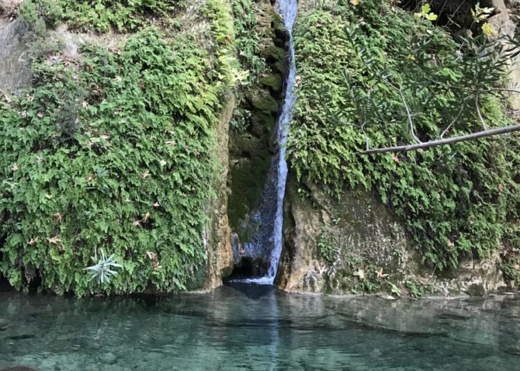 Aladere waterfall flowing through a lush forest near Kabak Valley, Fethiye