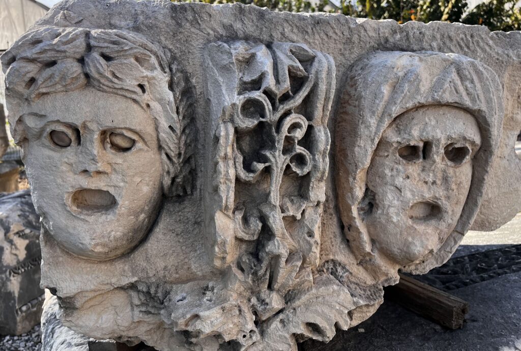 Carved theatrical mask corbels from the Roman theatre at Myra, Lycian stonework detail