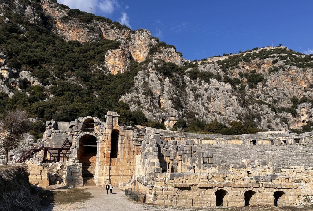 Panoramic view of Myra showing Lycian rock-cut tombs above the Roman theatre, Demre, Turkey