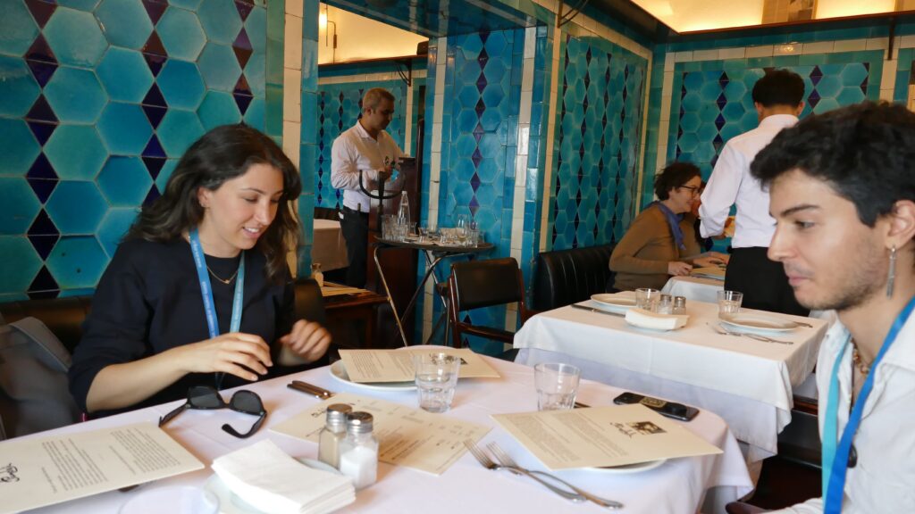 Guests reviewing the menu at Pandeli restaurant Istanbul, İznik tile dining room