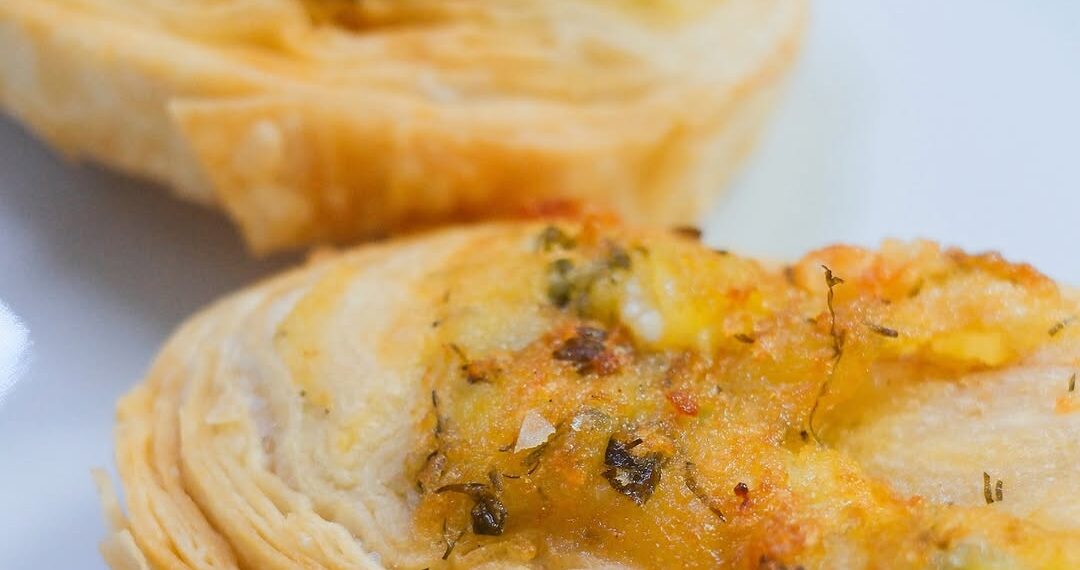 A close-up of İsmet Baba’s famous handmade potato börek, freshly baked and served warm at the historic Bosphorus restaurant in Istanbul