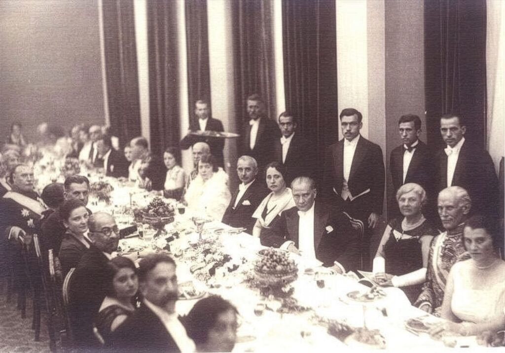 Historic black and white photograph of an early Turkish Republic banquet dinner with Atatürk, 1930s