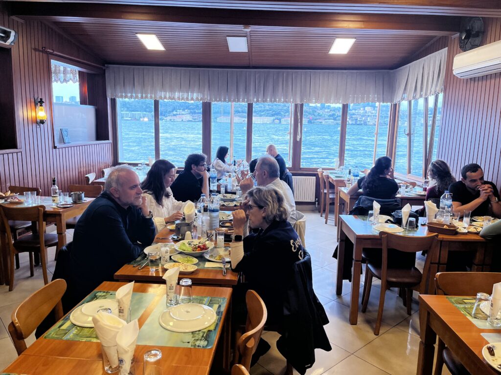 Interior of Ismet Baba Fish Restaurant in Kuzguncuk, featuring its traditional wooden dining room overlooking the Bosphorus.
