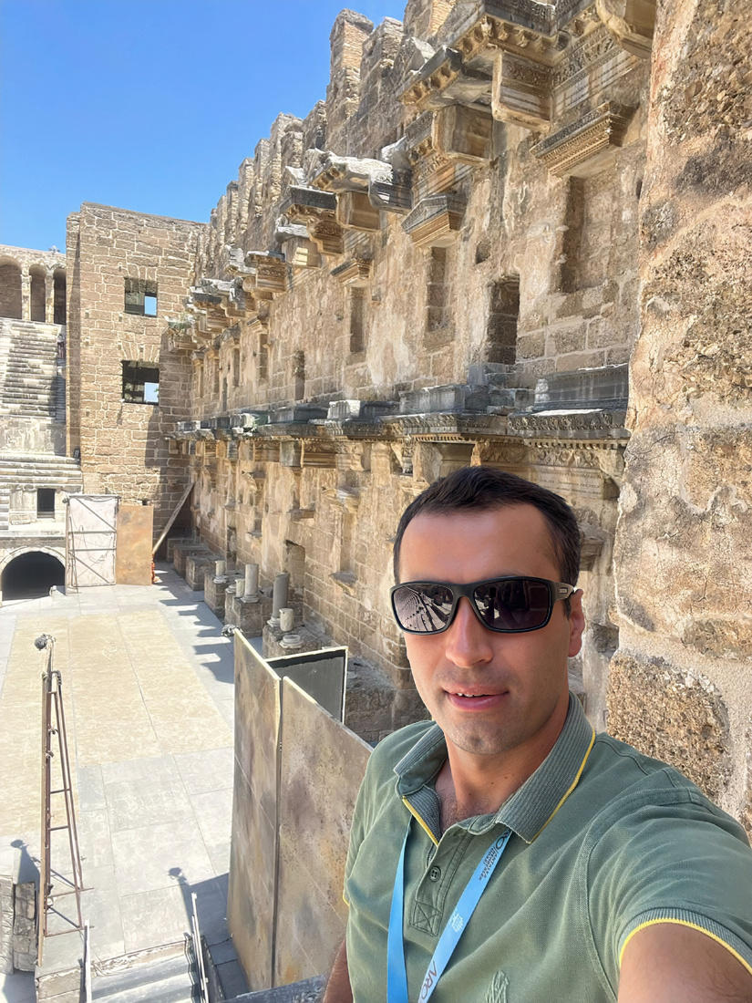 Ali Kütük, licensed tour guide, at the Roman scaena frons of Aspendos Theatre near Antalya, Turkey