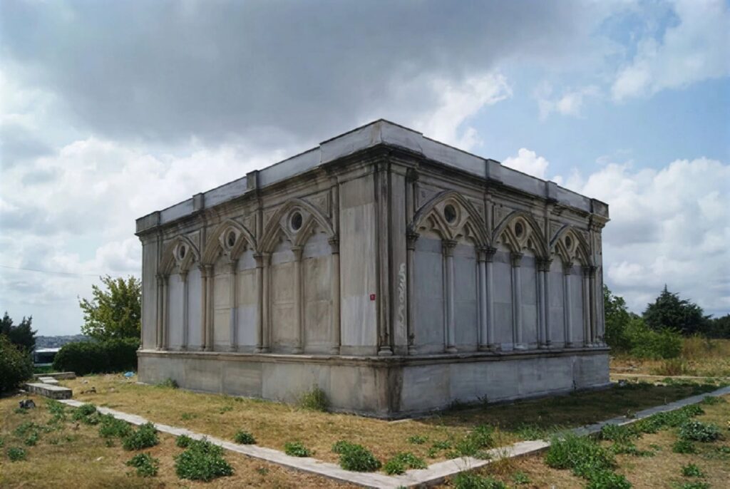 The neo-Gothic white marble mausoleum of banker Abraham Salomon de Camondo in the Hasköy Jewish Cemetery, Istanbul, its pointed arches and Gothic colonettes standing alone against a cloudy summer sky