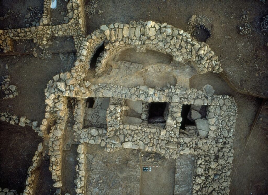 The Skull Building at Çayönü Tepesi photographed from above, showing stone-lined burial chambers used for secondary burial in the Pre-Pottery Neolithic