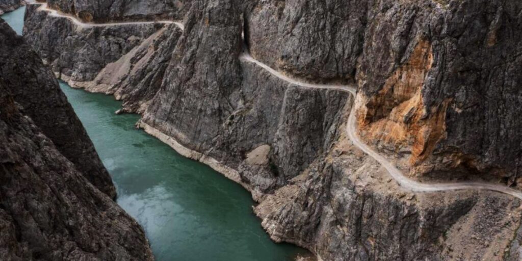 The cliffside road winding through Karanlık Canyon above the Karasu River in Erzincan, Turkey.