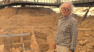 Archaeologist Murat Akman standing among the T-shaped pillars at the Göbekli Tepe excavation
