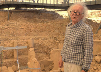 Archaeologist Murat Akman standing among the T-shaped pillars at the Göbekli Tepe excavation