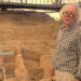 Archaeologist Murat Akman standing among the T-shaped pillars at the Göbekli Tepe excavation
