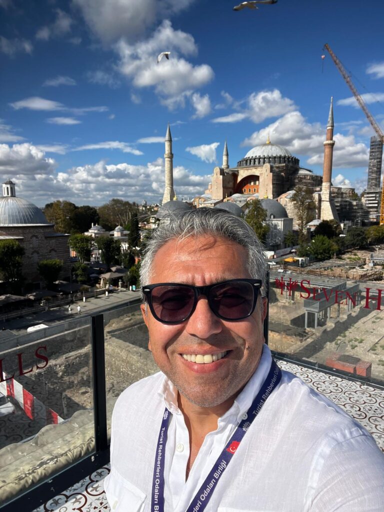 Licensed Istanbul tour guide Orçun Kamit posing in front of Hagia Sophia in Sultanahmet, Istanbul.