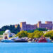 The Palace of the Grand Master of the Knights of Rhodes rising above the medieval harbour, visible from the sea as the ferry from Marmaris approaches — built by the same Hospitaller crusaders who constructed Bodrum castle across the strait