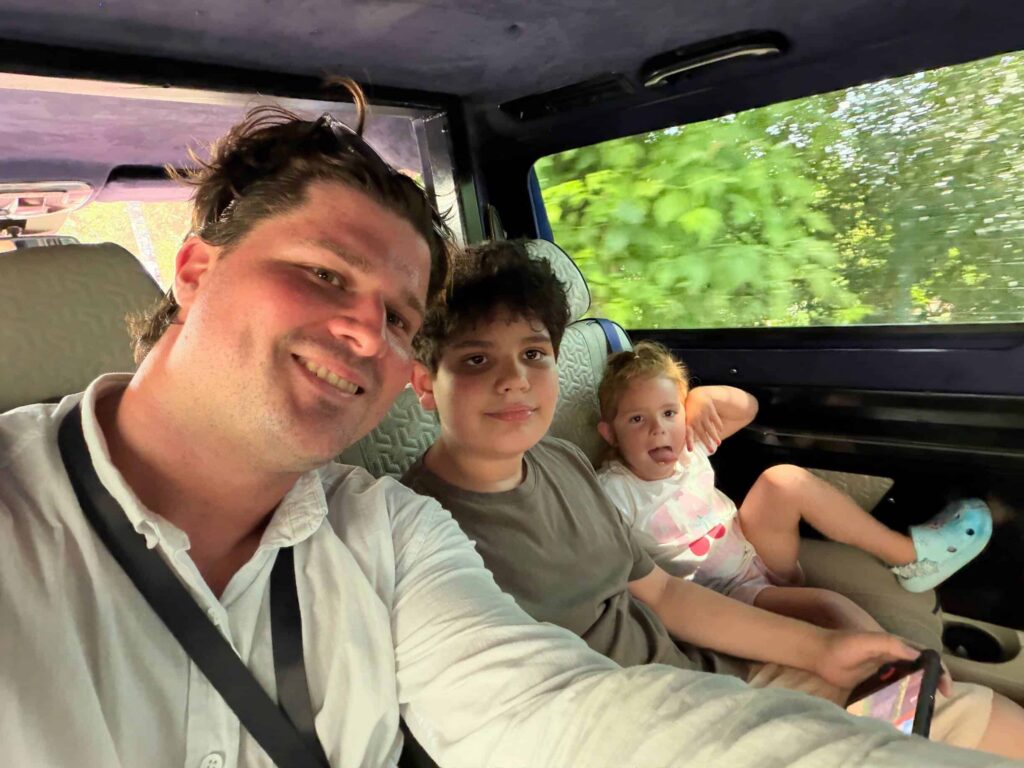 Deniz Karagozoglu with the kids inside the private van