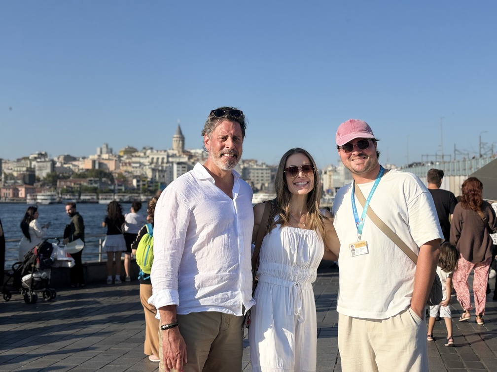 A guide walking with two guests beside the Golden Horn