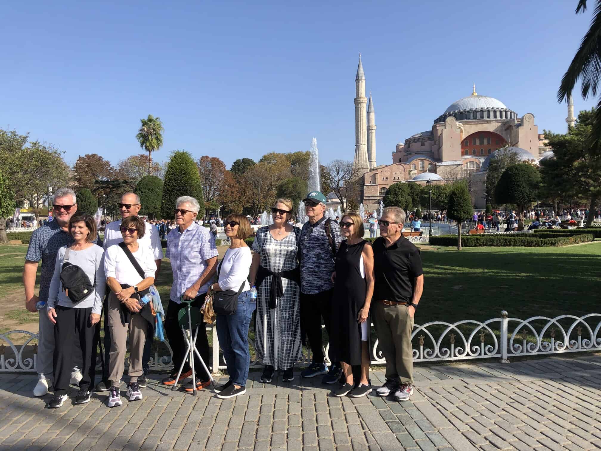 A group of guests standing together in front of Hagia Sophia on a sunny morning
