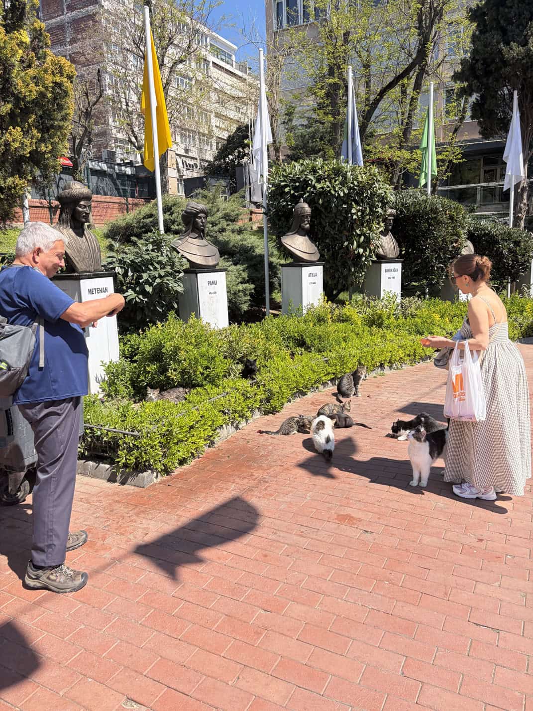 Jim and Selda pet the cats at Macka