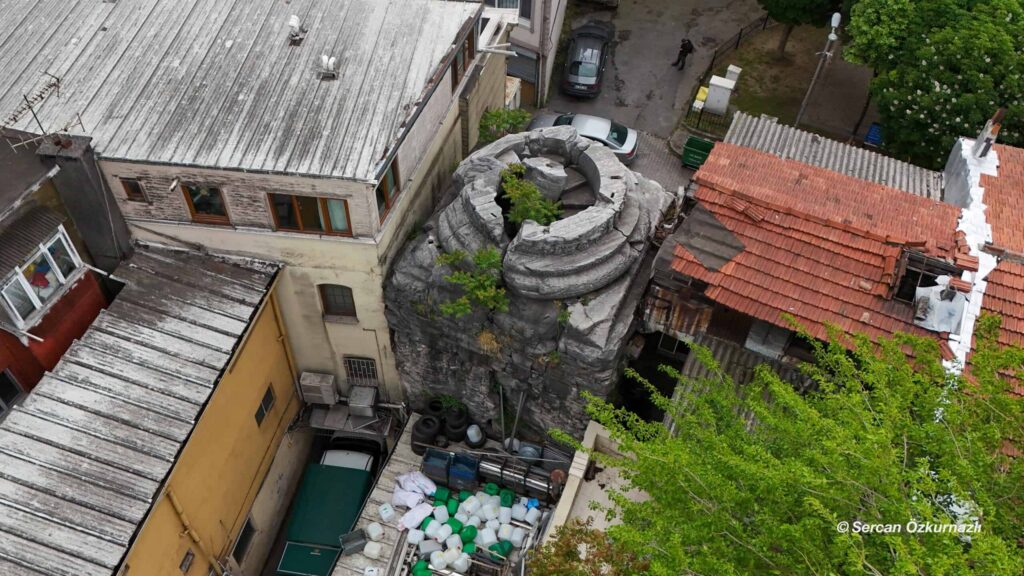 Surviving base of the Column of Arcadius enclosed by buildings in Cerrahpaşa