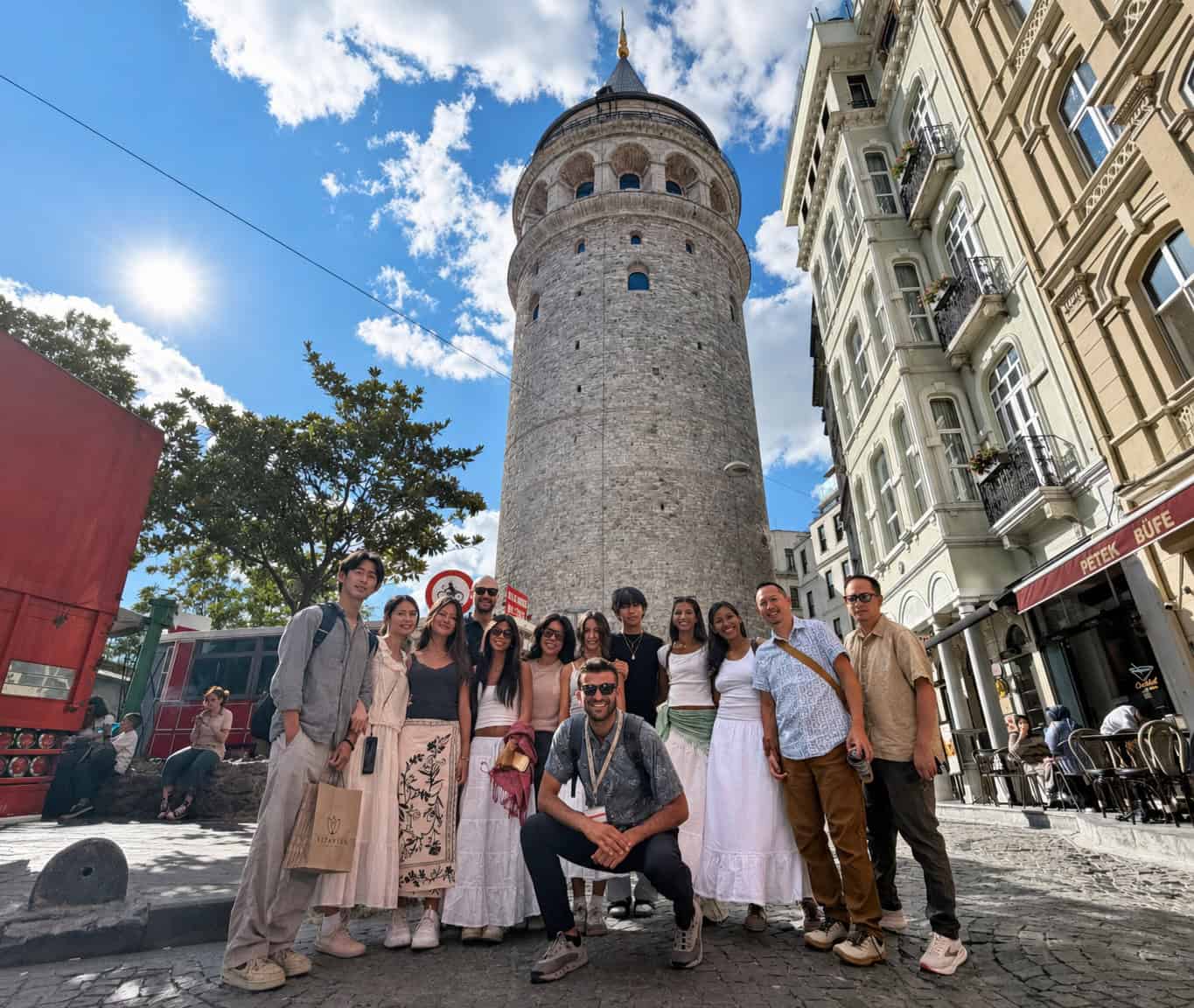 Omer Celik with a student group at the foot of the Galata Tower